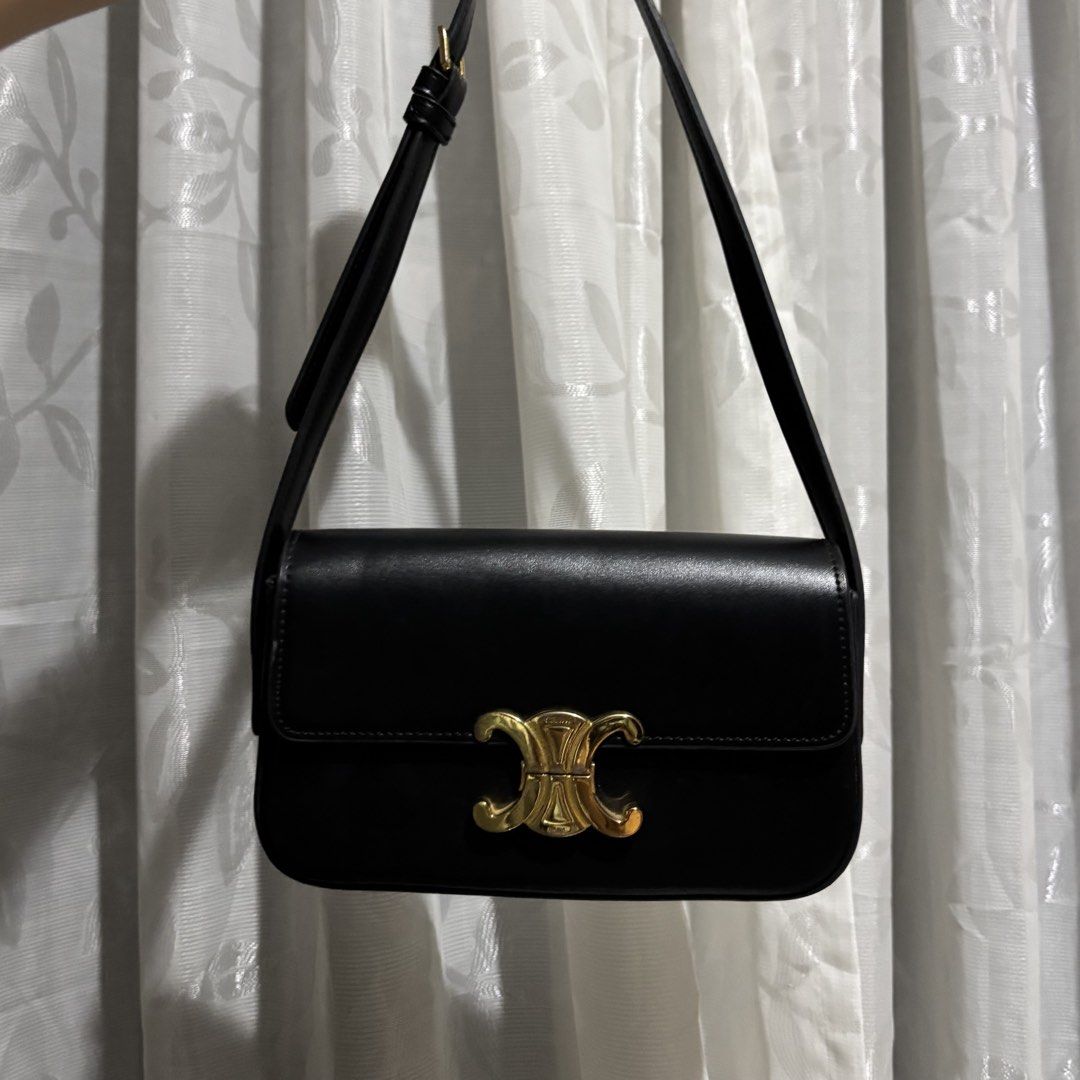 CELINE CLASSIQUE TRIOMPHE BAG BLACK (Category: Luxury Bags & Wallets) located in Paranaque City. Submitted by myunsterious (Listing ID 1436585712, Image 1). Description: - Celine Triomphe shoulder bag - Color: Black - Gold-tone clasp with Celine logo - Adjustable strap - Interior: Black with Celine Paris logo - Gold buckle detail on strap.
