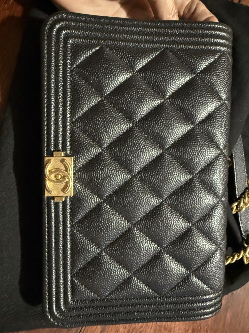 Chanel Boy Wallet on Chain Black (Category: Luxury Bags & Wallets) located in Calamba. Submitted by eskaparatengpuno (Listing ID 1436550513, Image 2). Description: - Authentic Chanel Boy Wallet on Chain - Excellent used condition, only used 5x max - Caviar leather - Gold hardware - Multiple interior compartments and zippered pocket - Includes dust bag - measures 19.2 x 12.3 x 3.5 cm.