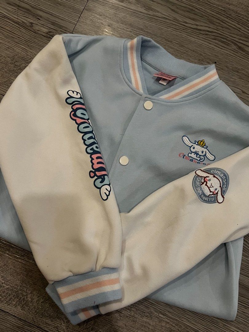Cinnamoroll Varsity Jacket (tween girls) (Category: Babies & Kids Fashion) located in Quezon. Submitted by ellephant21 (Listing ID 1436526311, Image 2). Description: - Light blue varsity jacket - Features Cinnamoroll embroidery - White sleeves with Cinnamoroll graphics - Button-up front - Striped collar, cuffs, and hem - Made of soft cotton material - 8-12 yo girl tween - Like new, no issue .