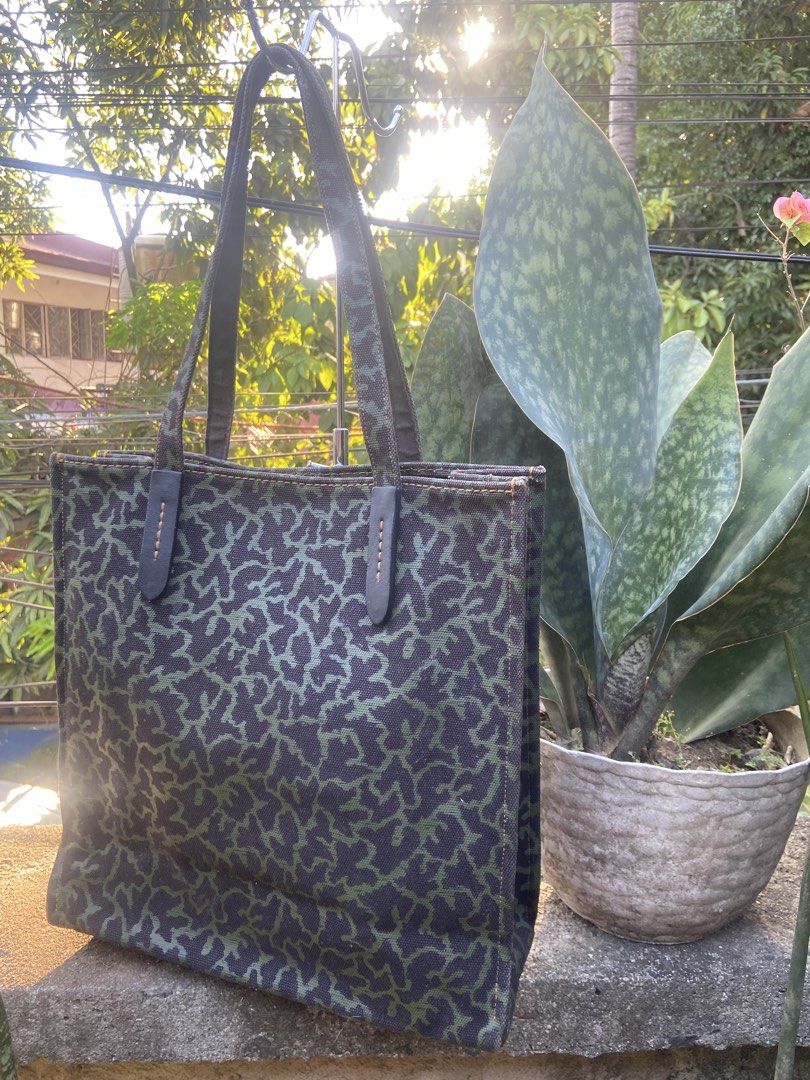 Coach Dalmatian Print Tote Bag (Category: Luxury Bags & Wallets) located in Manila. Submitted by baglovers10 (Listing ID 1436554983, Image 2). Description: - Coach tote bag - Dalmatian print design - Green and black pattern - Dalmatian patch on front - Two handles - Coach leather tag - Canvas material.
