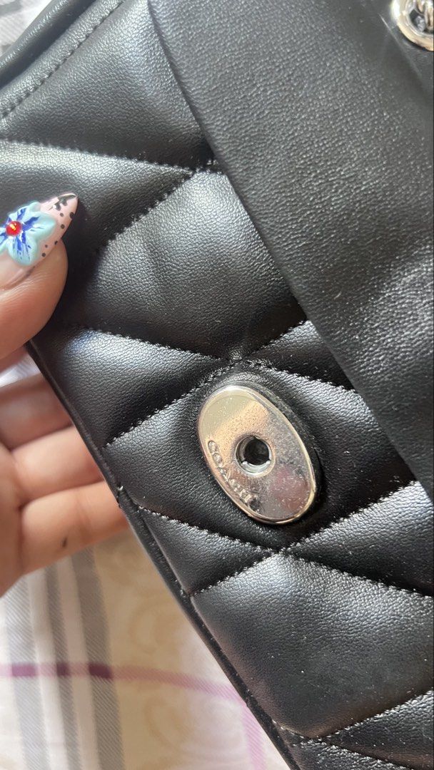 Coach Quilted Tabby 20 Shoulder Bag with silver hardware. (Category: Luxury Bags & Wallets) located in Quezon City. Submitted by samanthalim1989 (Listing ID 1436491044, Image 3). Description: - Coach Pillow Madison shoulder bag - Chain strap - Quilted design - Turnlock closure - Flap closure - Coach tag inside - Silver-tone hardware - Minor leather imperfections WHAT YOU SEE IS WHAT YOU GET ✔️ AUTHENTICATION NOT GUARANTEED ✔️ GIVEN AS A GIFT.