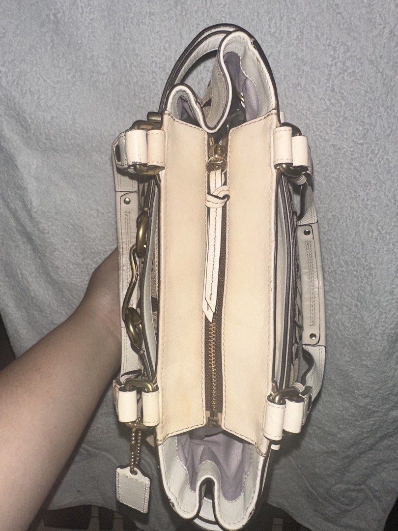 Coach Signature Tote Bag (Category: Luxury Bags & Wallets) located in Manila. Submitted by declutterw1thme (Listing ID 1436574749, Image 3). Description: - Authentic Coach tote bag - Signature print design - Beige leather trim - Gold-tone hardware - Secure zip closure.