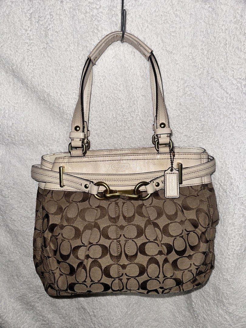 Coach Signature Tote Bag (Category: Luxury Bags & Wallets) located in Manila. Submitted by declutterw1thme (Listing ID 1436574749, Image 1). Description: - Authentic Coach tote bag - Signature print design - Beige leather trim - Gold-tone hardware - Secure zip closure.