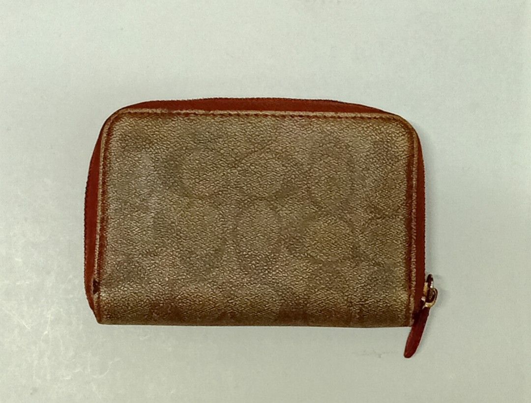 Coach Signature Zip Around Wallet (Category: Luxury Bags & Wallets) located in Navotas City. Submitted by riyuwi (Listing ID 1436625275, Image 2). Description: PREOWNED WellUsed Coach wallet with signature print - Zip-around closure - Red accents on flap and zipper - Multiple card slots - Clear ID window - Compartments for cash and essentials - Brown and red color scheme Off /Legit Sign of Used Good Condition 8.8/10.