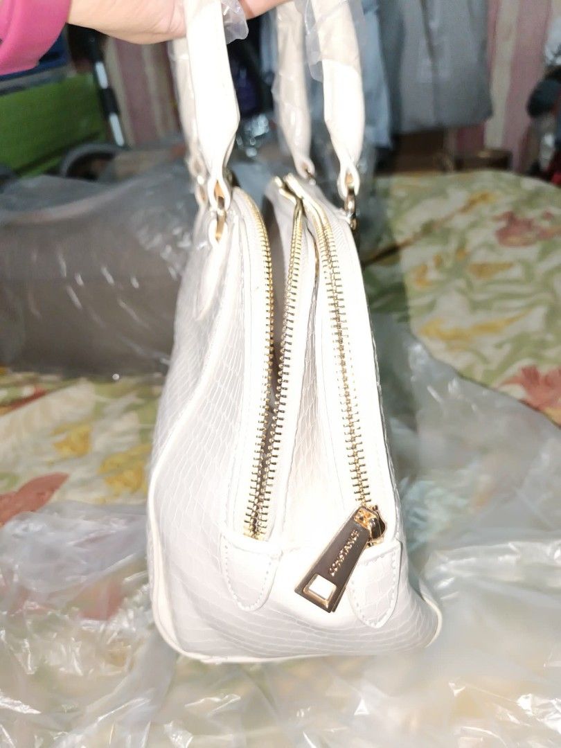 Constance Handbag White (Category: Luxury Bags & Wallets) located in Consolacion. Submitted by mencytte (Listing ID 1436649071, Image 2). Description: - Constance white handbag - Crocodile-skin texture - Gold-colored hardware - Top handle and detachable shoulder strap - Double zipper closure - Brand name detail.