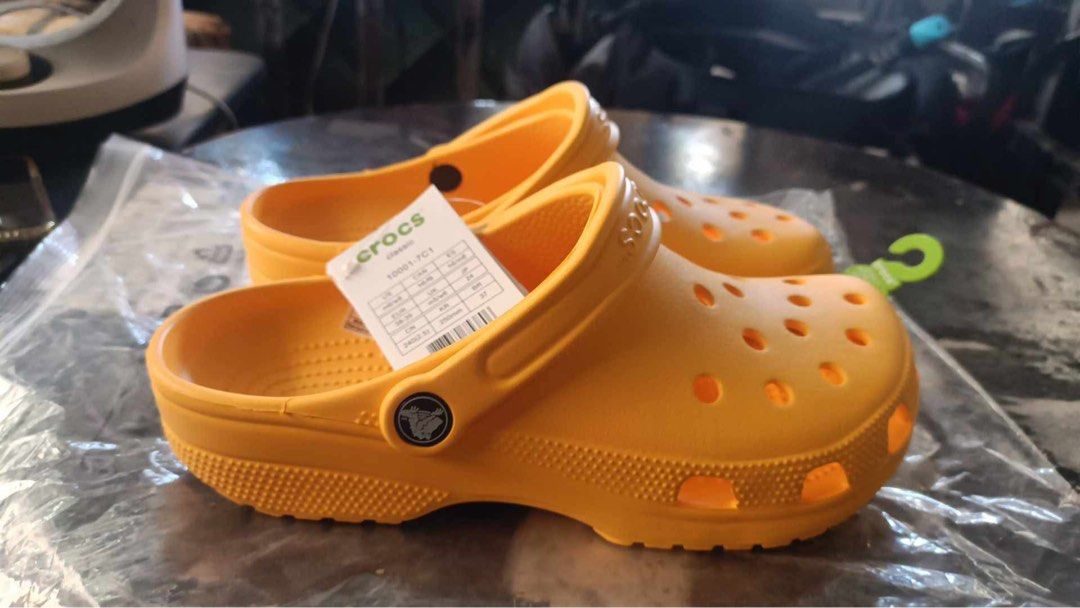 Crocs Classic Clogs - Yellow - Size W8/M6 (Category: Slippers & Slides) located in Manila. Submitted by bukid (Listing ID 1436557679, Image 3). Description: - Authentic Crocs Classic Clogs - Vibrant yellow color - Size: W8/M6 - Made in Vietnam - Classic design with ventilation ports - Perfect for casual wear - Easy to clean - Comes with original tag.