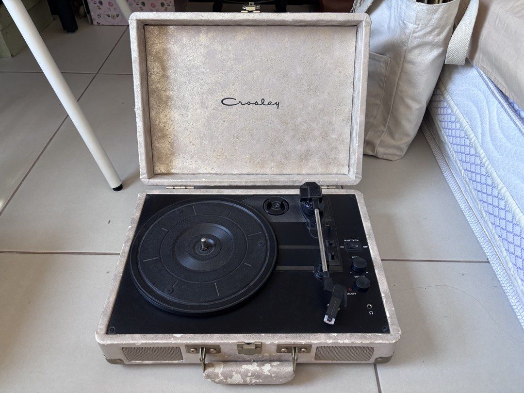 Crosley Cruiser Turntable / Record Player (Category: Portable Music Players) located in Makati City. Submitted by bamalouwear (Listing ID 1436516558, Image 1). Description: READ ME BEFORE PURCHASING! Selling my Crosley Cruiser suitcase turntable bought from Urban Outfitters in 2016. Still works very well and speakers/functionality are in good condition. Exterior has visible peeling, discoloration, and cosmetic wear due to age/storage (see photos)