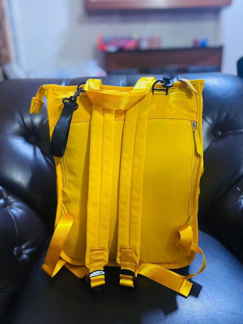 Diaper Bag Backpack (Category: Backpacks) located in Caloocan City. Submitted by sassy1013 (Listing ID 1436580107, Image 2). Description: - Bright yellow backpack - Adjustable shoulder straps - Features a front pocket and top handle - Durable material - Zipper closure - Includes a black side strap.