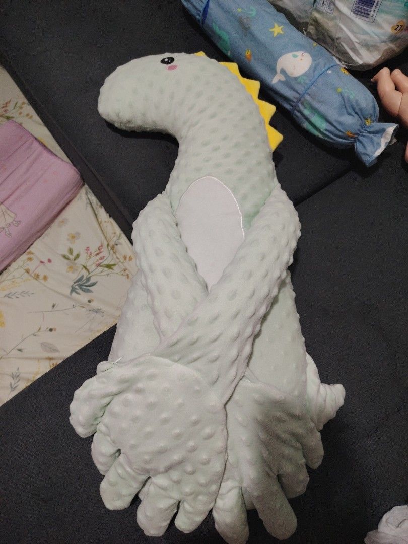 Dinosaur Plush Toy (Category: Plushies & Soft Toys) located in Makati City. Submitted by jayclutter0976004 (Listing ID 1436493041, Image 1). Description: - Super soft and huggable dinosaur plush toy. - Features a cute design with a light green body and yellow spikes. - Friendly face and crossed arms for extra cuddles. - Great for kids or as a decorative piece..