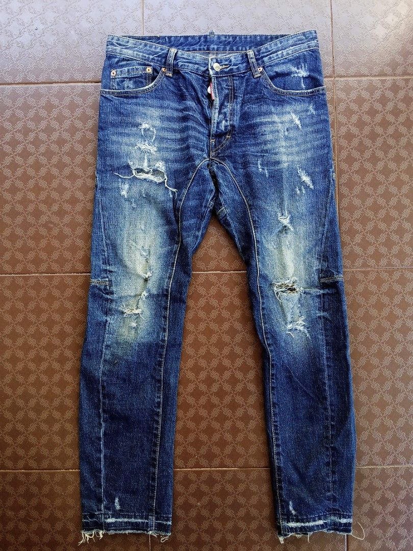 DSQUARED2 Distressed Jeans (Category: Jeans) located in Davao. Submitted by carnopaul76938 (Listing ID 1436540909, Image 1). Description: - Authentic DSQUARED2 jeans - Distressed style - Button closure with DSQUARED2 tag - Faded blue wash with ripped details - Leather brand patch at the back - Size 48 - Made in Italy.