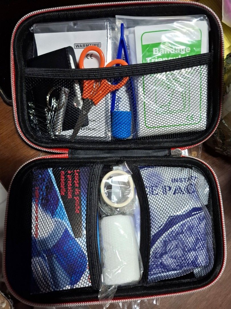 Emergency First Aid Kit (Category: Medical Supplies & Tools) located in Quezon City. Submitted by an.marie (Listing ID 1436557921, Image 3). Description: - Compact red first aid kit - Contains: bandages, antiseptic wipes, scissors, and many more.. - Zippered closure for secure storage - Sealed in plastic - Perfect for travel, home, or car emergencies.