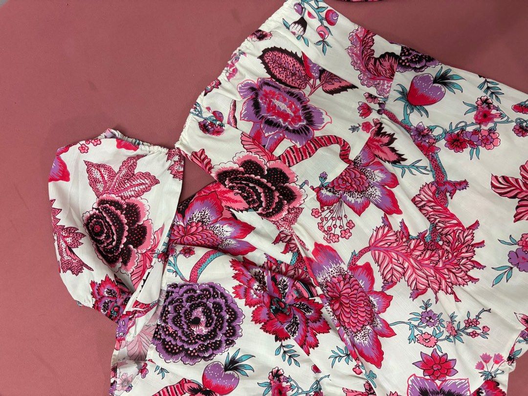 Floral Off-Shoulder Dress (Category: Dresses) located in Manila. Submitted by closetsofaddie (Listing ID 1436586483, Image 2). Description: - Floral off-shoulder dress - Vibrant pink and purple floral print - White background - Flattering silhouette with cinched waist - Flowing skirt - Long dress with puff sleeves - Perfect for special occasions or beach getaway style 💳Mode of Payment: 💙 GCash 🧡 MariBank 🩵 GoTyme 💸 Cash if Meetup! 🚚Mode of 