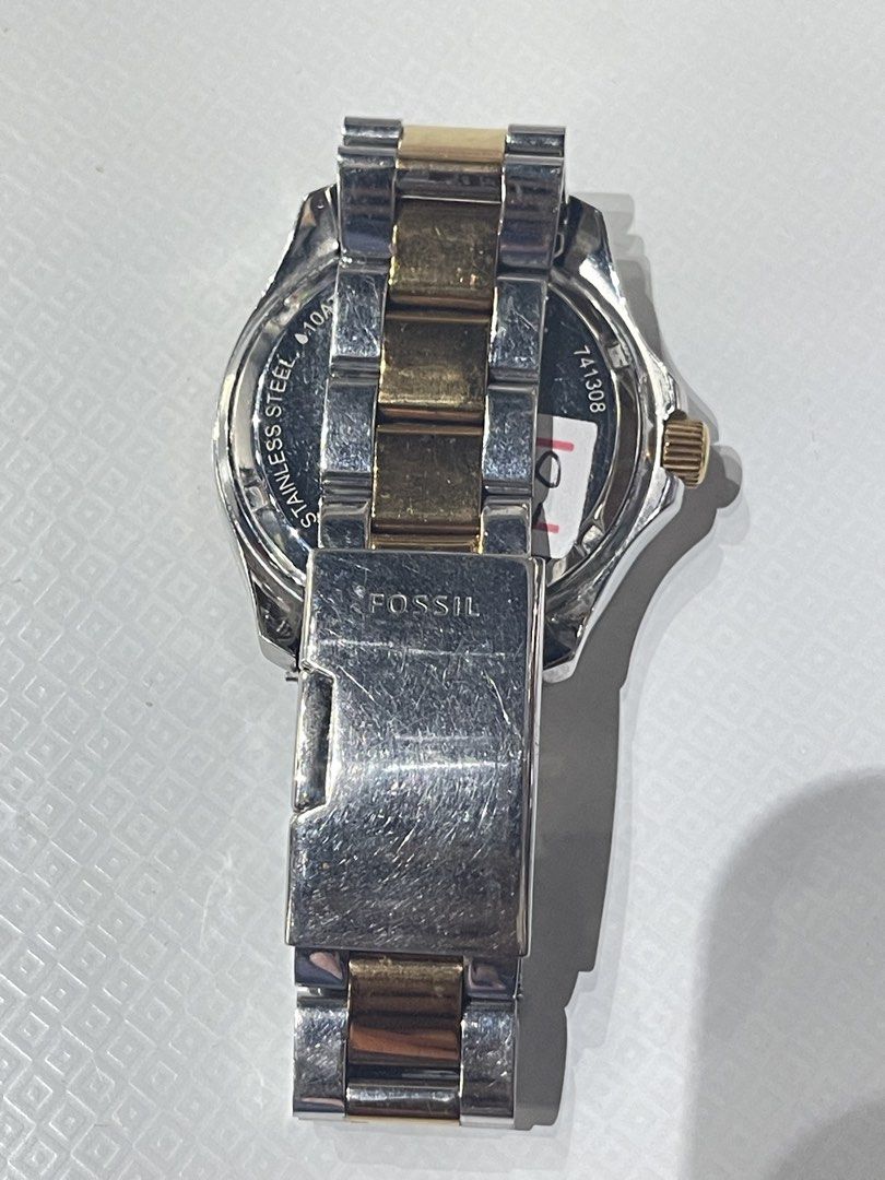 Fossil Watch with Gold Accents (Category: Women's Watches) located in Binangonan. Submitted by chasechloe (Listing ID 1436499041, Image 2). Description: Fossil AM-4496 - Fossil watch with a silver dial. - Gold-tone hands and Roman numeral hour markers. - Gold-tone bezel with crystal accents. - Stainless steel band with gold-tone links. - Includes three sub-dials and a date display. - Perfect for everyday wear. MOD: - LBC (COD/COP with downpayment