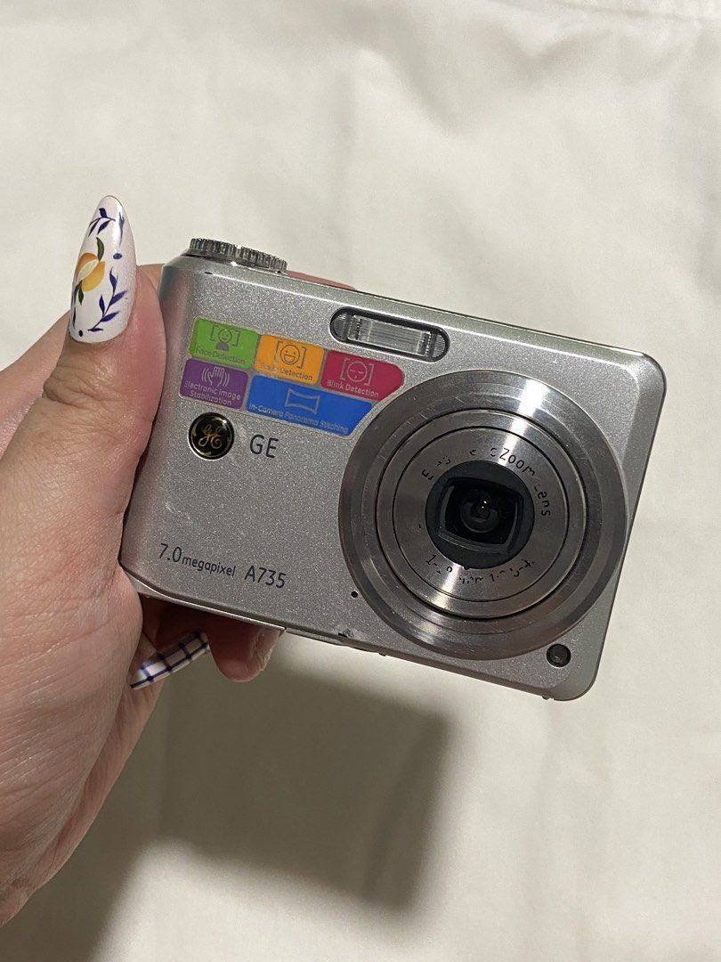 GE A735 Silver DigiCam (Working) (Category: Cameras) located in San Fernando. Submitted by _wntrshp (Listing ID 1436631271, Image 1). Description: - ge a735 digital camera - 7.0 mp, silver body - built-in red flash + working zoom lens - A4 battery included (no sd card) - LCD issue: shows white screen while taking pics, so preview is limited - buttons seem to be working, though not fully tested due to LCD issue - photos still come out clear & cris