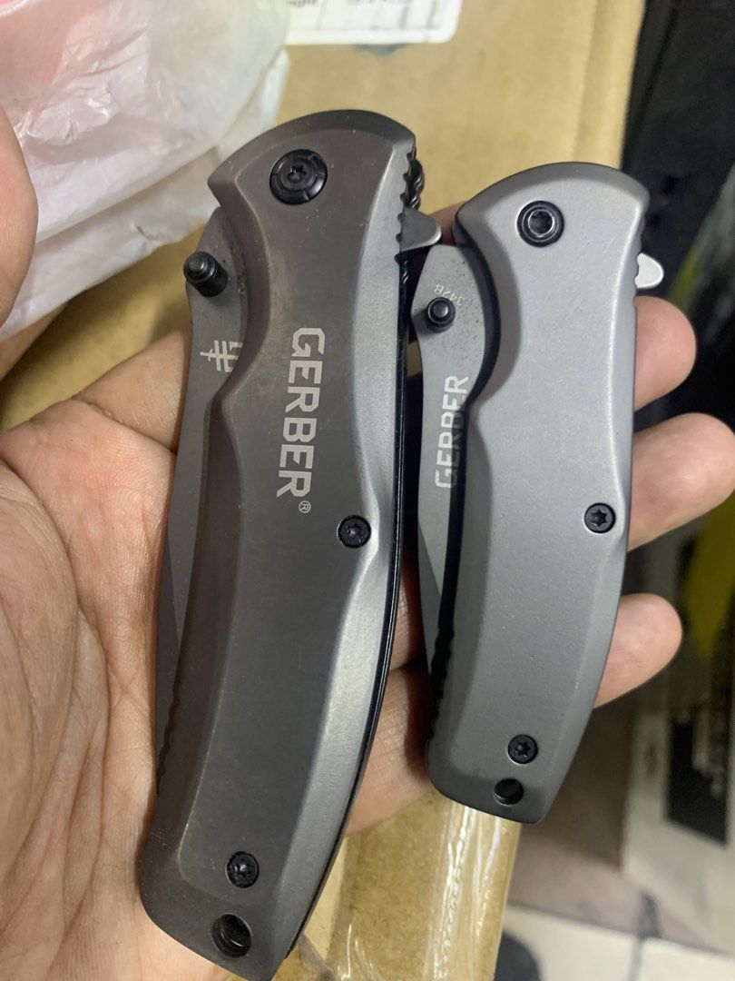 Gerber Pocket Knife Set (Category: Hiking & Camping) located in Pasig City. Submitted by wild_rex_blaza (Listing ID 1436649813, Image 1). Description: Gerber Utility foldable Knife brand new with boxes 2 for 980 ( big and small) Gray reason for selling: Decluttering collection .