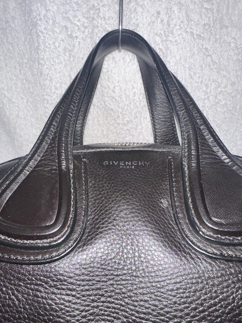 Givenchy Nightingale Handbag (Category: Luxury Bags & Wallets) located in Manila. Submitted by declutterw1thme (Listing ID 1436577440, Image 3). Description: - Authentic Givenchy Nightingale handbag - Classic black leather - Top handle and detachable shoulder strap - Secure zip closure - Stylish silver-tone hardware - Iconic Givenchy logo.