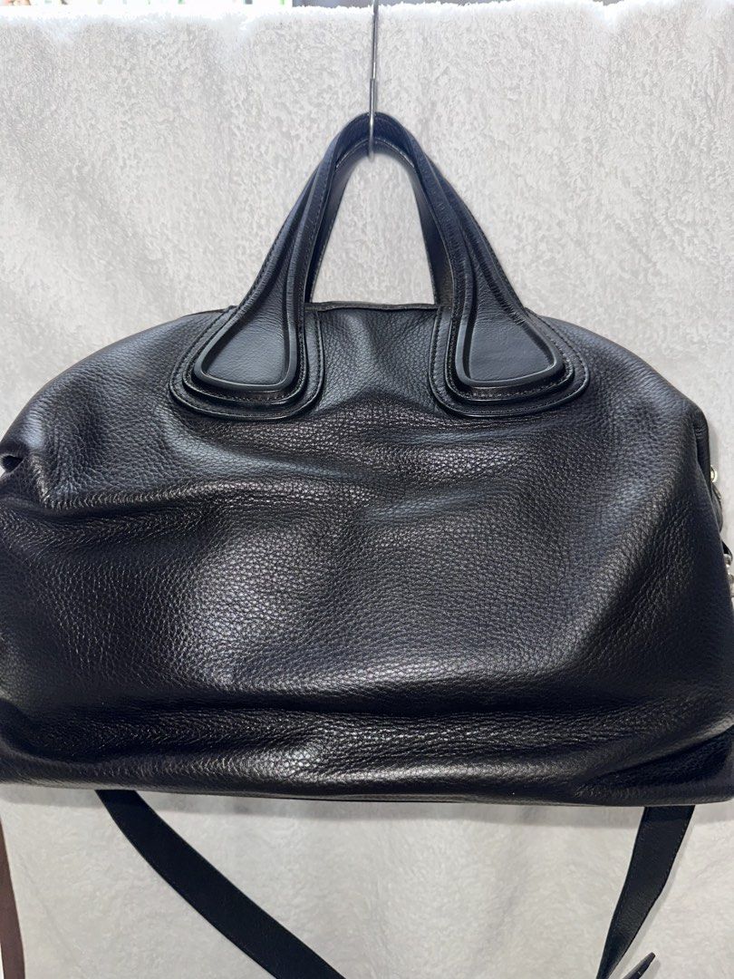 Givenchy Nightingale Handbag (Category: Luxury Bags & Wallets) located in Manila. Submitted by declutterw1thme (Listing ID 1436577440, Image 2). Description: - Authentic Givenchy Nightingale handbag - Classic black leather - Top handle and detachable shoulder strap - Secure zip closure - Stylish silver-tone hardware - Iconic Givenchy logo.