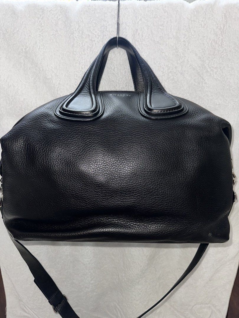 Givenchy Nightingale Handbag (Category: Luxury Bags & Wallets) located in Manila. Submitted by declutterw1thme (Listing ID 1436577440, Image 1). Description: - Authentic Givenchy Nightingale handbag - Classic black leather - Top handle and detachable shoulder strap - Secure zip closure - Stylish silver-tone hardware - Iconic Givenchy logo.
