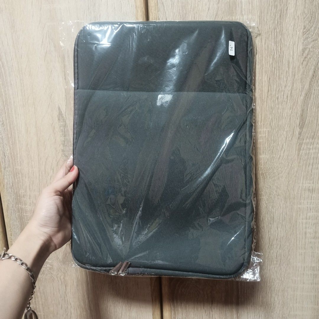 Gray Laptop Bag 14 inches (Category: Laptop Bags & Sleeves) located in Taguig. Submitted by oddlykawaiishop.ph (Listing ID 1436604301, Image 1). Description: ❤️ This laptop bag has two compartments—one main and one for chargers, mouse pad, etc. ❤️ It is of foam material. RFS: Maling size na order 😭 Originally bought for 122. Literally just got the item as of today, May 7th. .