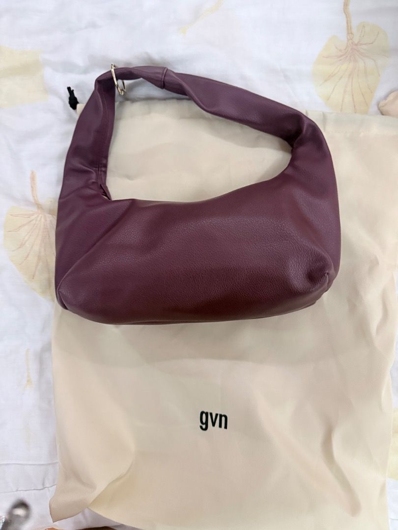 GVN Shoulder Bag in Ox Blood (Category: Shoulder Bags) located in Caloocan City. Submitted by badbunny324 (Listing ID 1436598639, Image 2). Description: - Burgundy gvn shoulder bag - Curved design - Single shoulder strap - Gold-toned zipper and hardware - Includes dust bag - Gvn logo on front.
