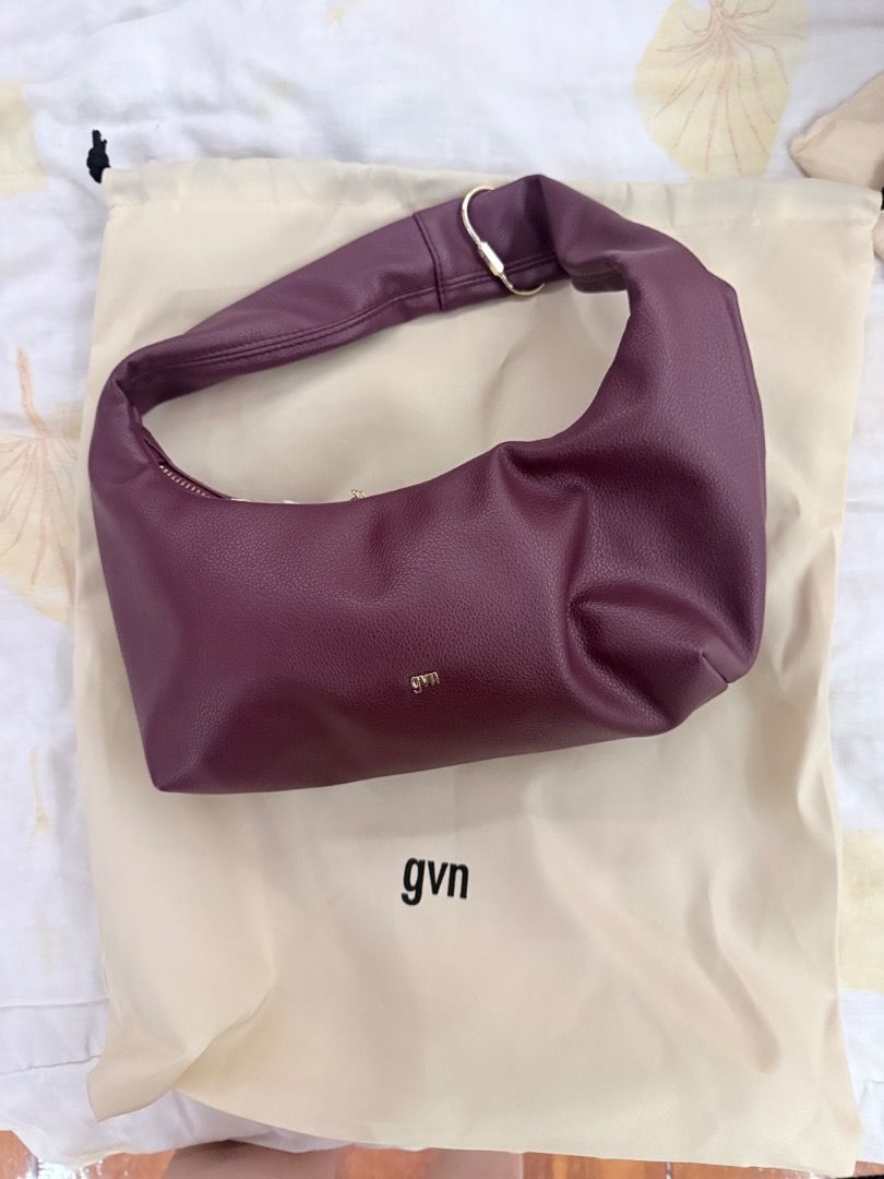 GVN Shoulder Bag in Ox Blood (Category: Shoulder Bags) located in Caloocan City. Submitted by badbunny324 (Listing ID 1436598639, Image 1). Description: - Burgundy gvn shoulder bag - Curved design - Single shoulder strap - Gold-toned zipper and hardware - Includes dust bag - Gvn logo on front.