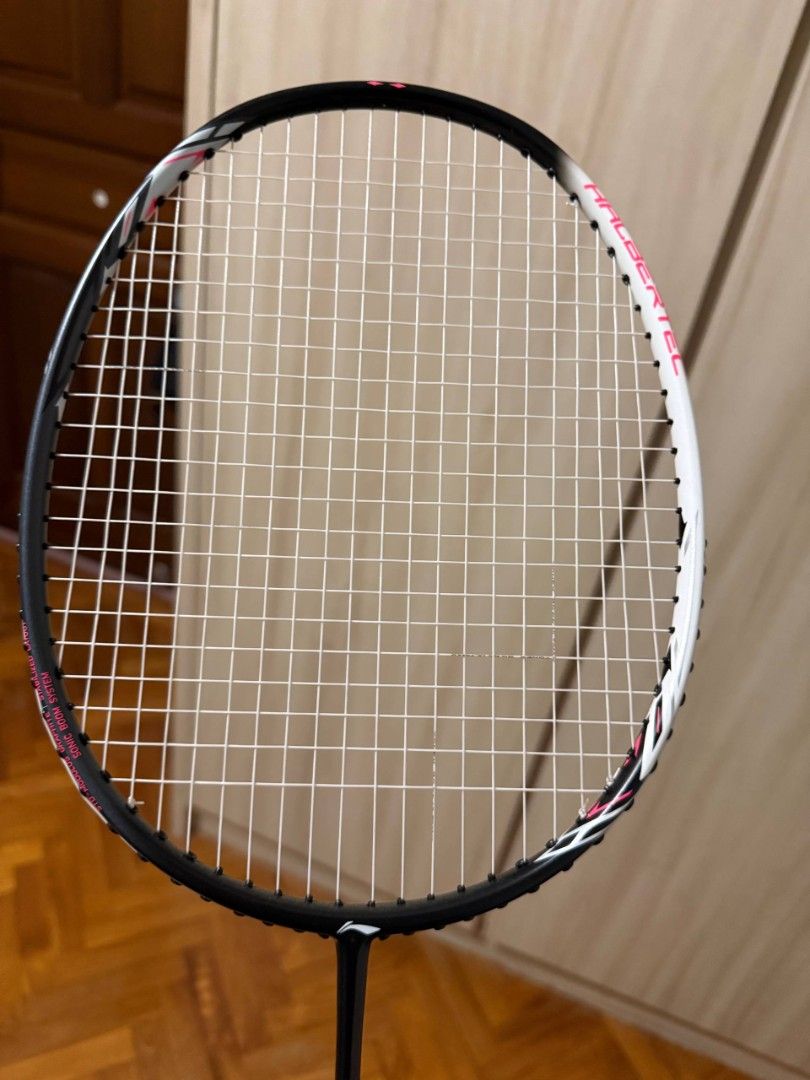 Halbertec 2000 (Category: Racket & Ball Sports) located in Singapore. Submitted by leowongkx123 (Listing ID 1436613924, Image 3). Description: - Brand new Li-Ning badminton racket - Stylish black, white, and pink design - Ideal for casual and competitive players.