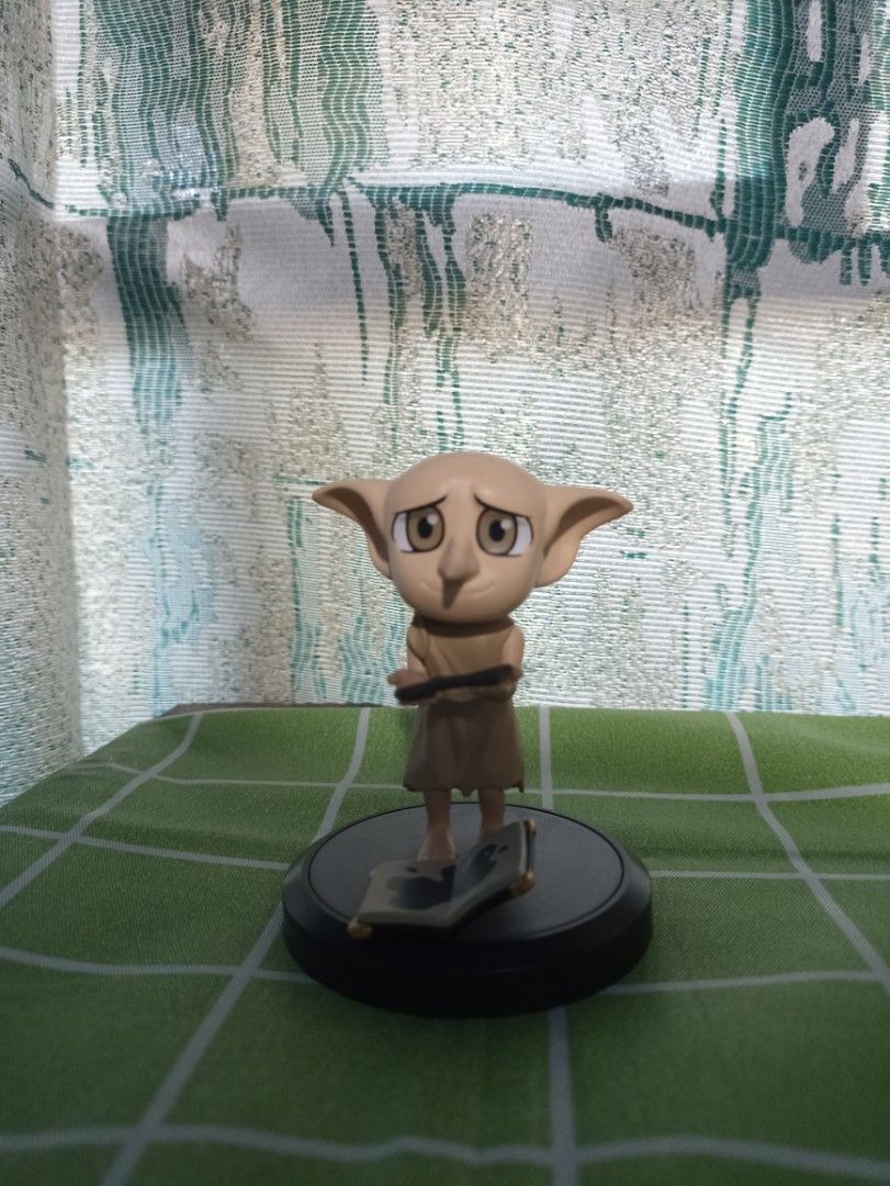 Harry Potter Dobby Figurine (Category: Figurines & Statues) located in Manila. Submitted by hobbymo_koleksyon.ph (Listing ID 1436492106, Image 1). Description: Dobby figurine is a collectible item from the Wizarding World. It features Dobby standing on a base. The base has text indicating it is a licensed product. The figurine is made in China. It is a great addition to any Harry Potter collection. 100% authentic and a miniso product. .