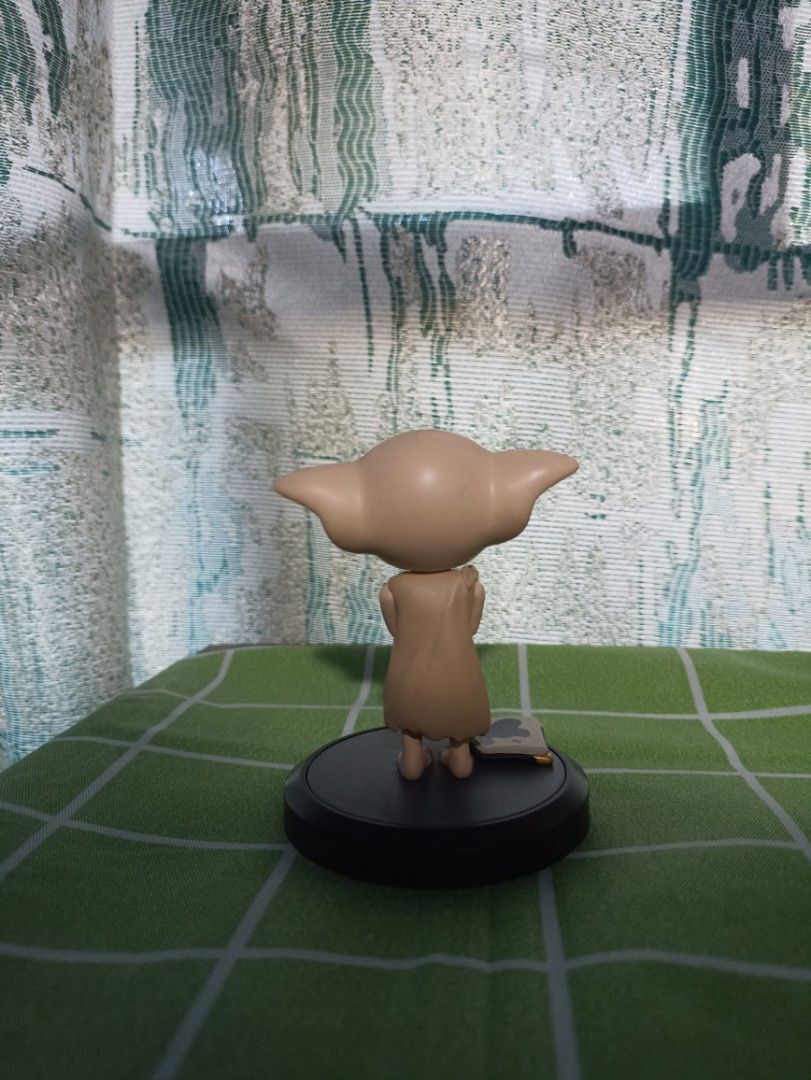 Harry Potter Dobby Figurine (Category: Figurines & Statues) located in Manila. Submitted by hobbymo_koleksyon.ph (Listing ID 1436492106, Image 2). Description: Dobby figurine is a collectible item from the Wizarding World. It features Dobby standing on a base. The base has text indicating it is a licensed product. The figurine is made in China. It is a great addition to any Harry Potter collection. 100% authentic and a miniso product. .