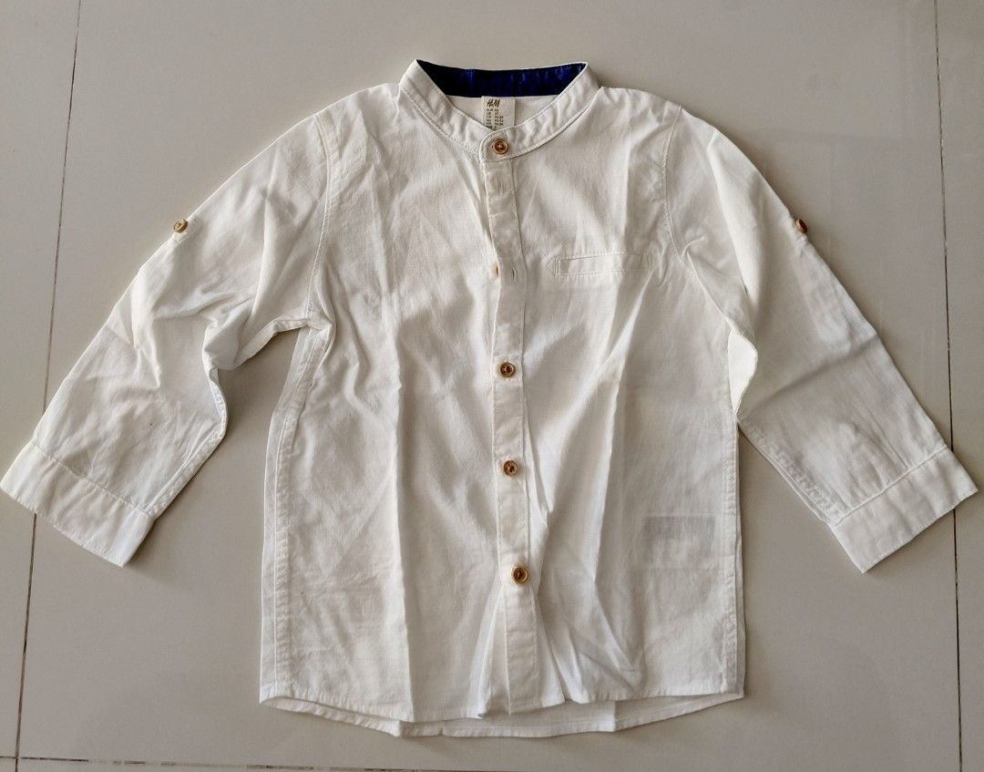 H&M White Long Sleeve Shirt (Category: Babies & Kids Fashion) located in San Pedro. Submitted by charmz24 (Listing ID 1436525783, Image 1). Description: - H&M white long sleeve shirt - Size: 2T - Mandarin collar with navy blue inner lining -no flaws - RFS: outgrown.