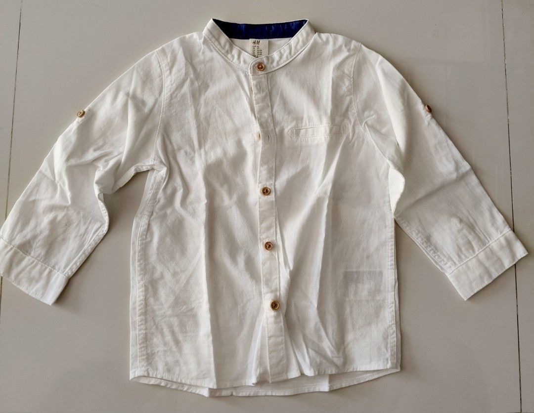 H&M White Long Sleeve Shirt (Category: Babies & Kids Fashion) located in San Pedro. Submitted by charmz24 (Listing ID 1436525783, Image 2). Description: - H&M white long sleeve shirt - Size: 2T - Mandarin collar with navy blue inner lining -no flaws - RFS: outgrown.