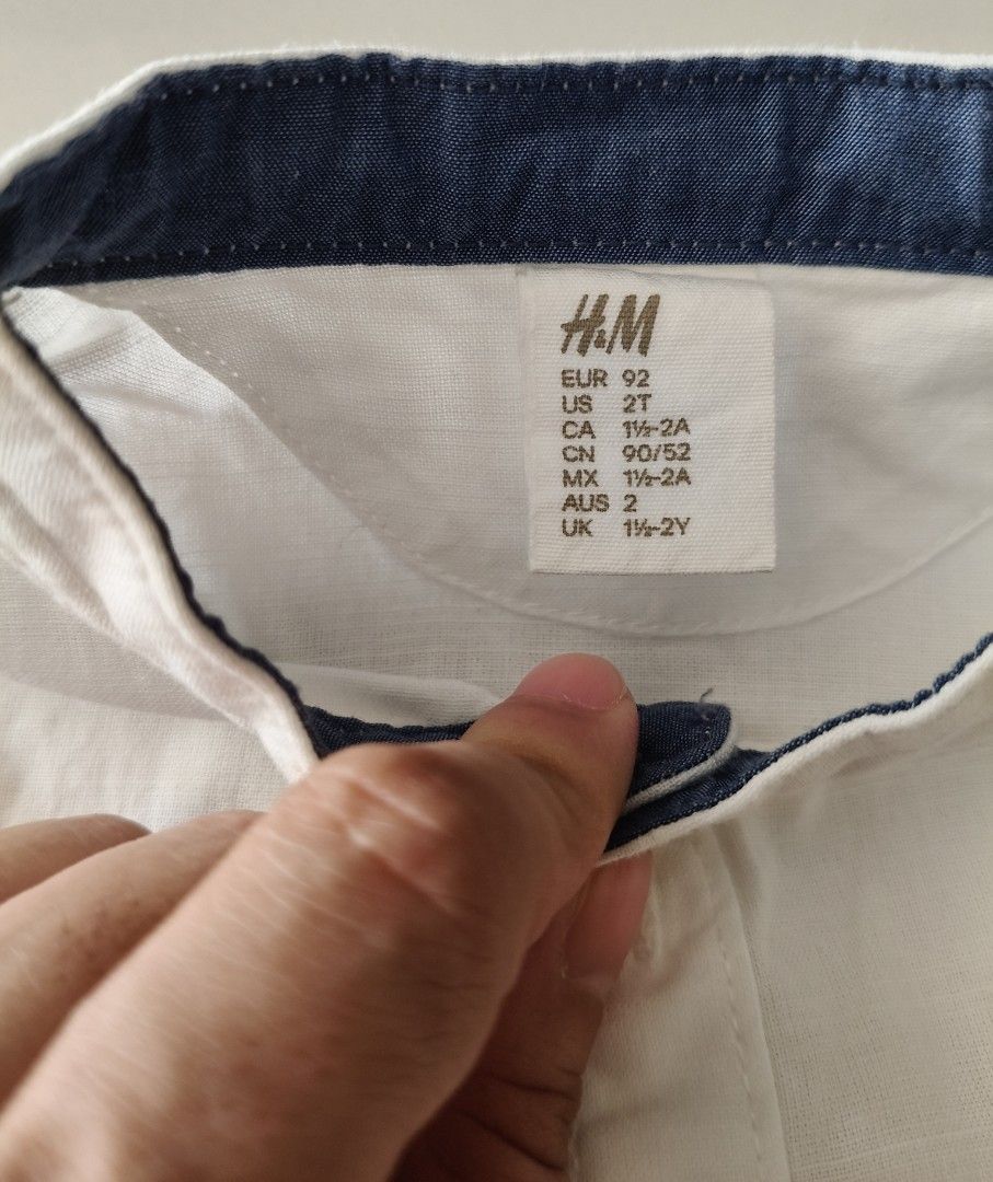 H&M White Long Sleeve Shirt (Category: Babies & Kids Fashion) located in San Pedro. Submitted by charmz24 (Listing ID 1436525783, Image 3). Description: - H&M white long sleeve shirt - Size: 2T - Mandarin collar with navy blue inner lining -no flaws - RFS: outgrown.