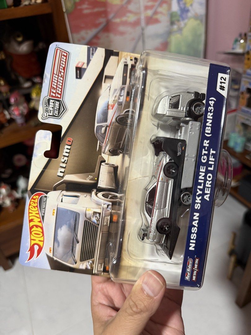 Hot Wheels - Transporter R34 Aero Lift + Nissan Skyline GTR (Category: Vehicle & Diecast Models) located in Singapore. Submitted by pohteck1 (Listing ID 1264389075, Image 3). Description: Brand New Box Condition: minor imperfection (discount given) Quantity: 2.