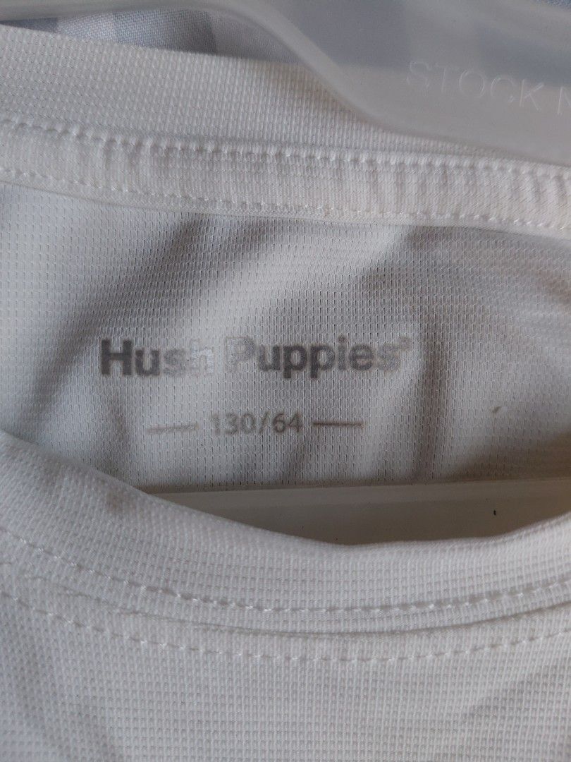 Hush Puppies T-shirt (Category: Shirts) located in Cainta. Submitted by projectunoph (Listing ID 1436556594, Image 2). Description: - Hush Puppies T-shirt - Color: Cream - Size: 130/64 - Dimensions: 16x20 - Features the Hush Puppies logo on the front and back - Made of breathable material - Short sleeves - Crew neck - Perfect for everyday wear.