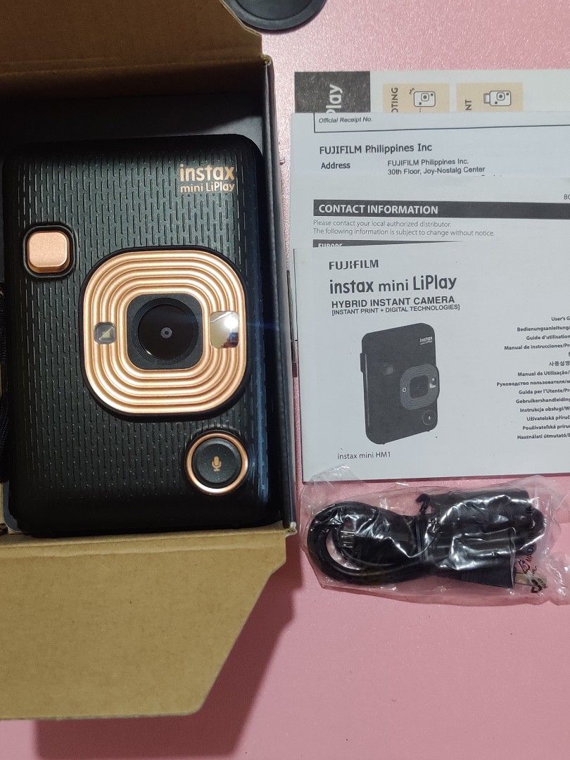 INSTAX MINI LIPLAY (Category: Cameras) located in Calamba. Submitted by mayceefray74436 (Listing ID 1436517388, Image 3). Description: The Fujifilm Instax Mini LiPlay is a compact hybrid instant camera and smartphone printer, allowing users to shoot, view, and select photos on a 2.7-inch LCD screen before printing. It features sound recording, which converts audio into a QR code on the print, and allows direct printing from smartphones. *no memor