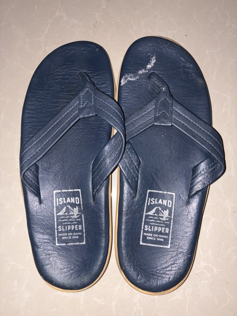 Island Slipper Pro Flip-flops - Size 10 (Category: Slippers and slides) located in Placer. Submitted by talaalond61563 (Listing ID 1436614420, Image 2). Description: - Island Slipper Pro flip-flops - Size: 10 - Color: Navy blue leather upper, tan sole - Features the Island Slipper logo - Made in Oahu since 1946 - Soles show some wear.
