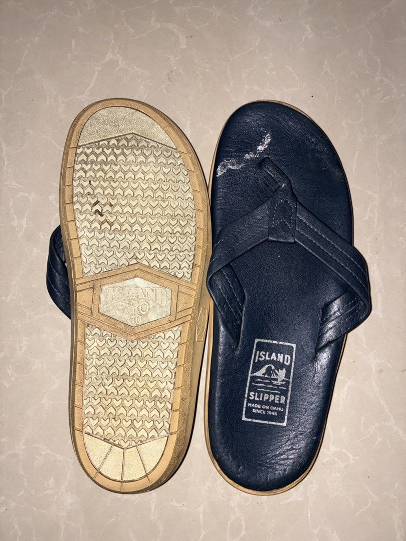 Island Slipper Pro Flip-flops - Size 10 (Category: Slippers and slides) located in Placer. Submitted by talaalond61563 (Listing ID 1436614420, Image 3). Description: - Island Slipper Pro flip-flops - Size: 10 - Color: Navy blue leather upper, tan sole - Features the Island Slipper logo - Made in Oahu since 1946 - Soles show some wear.