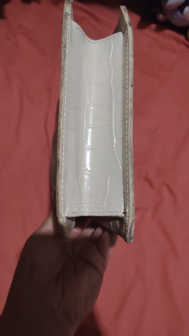 Jacquemus Le Chiquito Handbag (Category: Luxury Bags & Wallets) located in Santa Rosa. Submitted by RRRR0520 (Listing ID 1436556645, Image 3). Description: - Ivory Jacquemus Le Chiquito handbag - Structured rectangular shape - Top handle - Flap closure with gold Jacquemus logo - Crocodile-textured exterior - Gold-tone ring detail MISSING SLING.