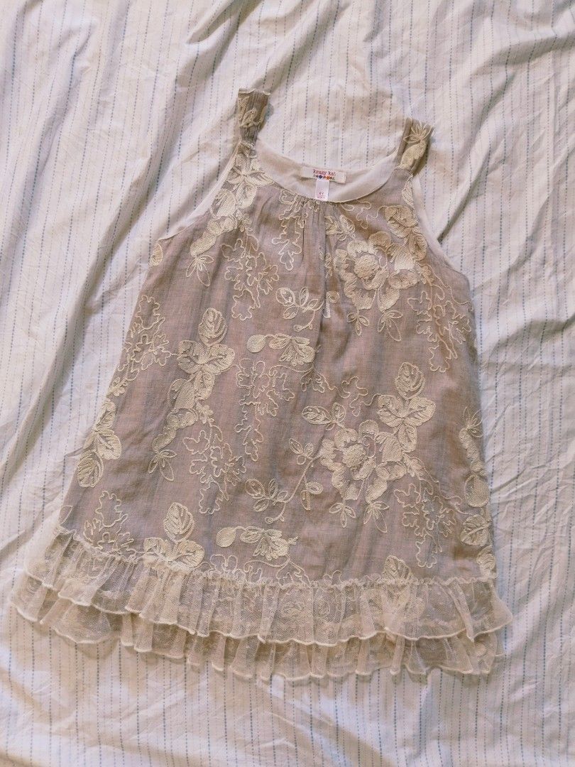 Krazy Kat Embroidered Dress (Category: Babies & Kids Fashion) located in Pasig City. Submitted by babylove2003 (Listing ID 1436504189, Image 1). Description: Beautiful dress from Krazy Kat, size 6Y (may fits 8Y petit). Features intricate floral embroidery and a layered ruffle hem. The dress has a sleeveless design with a round neckline. Made in India. The dress has a light beige color and light linen fabric with inner..