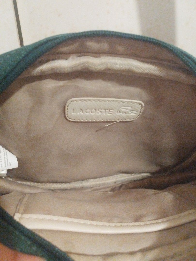 Lacoste Green Crossbody Bag (Category: Cross-body Bags) located in Pasig City. Submitted by maxipie (Listing ID 1436522722, Image 2). Description: - Lacoste crossbody bag - Vibrant green color - Main compartment - Front pocket - Adjustable strap - Interior Lacoste label - Stylish and classic design 📍 Location: Pasig.