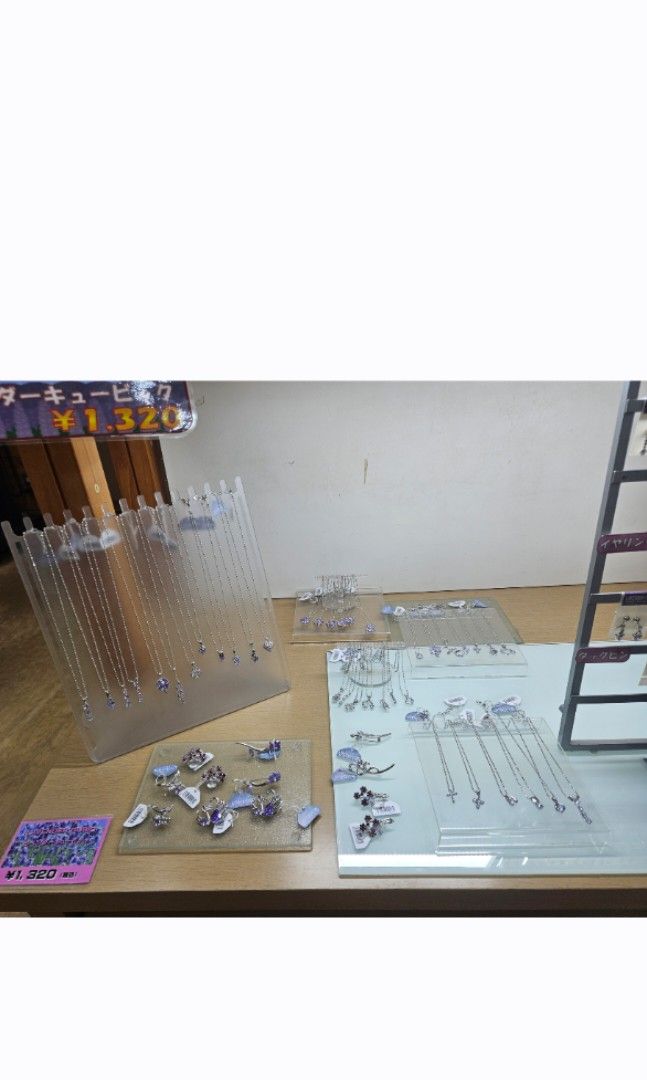 Lavender Cubic Earrings & Choker Necklace (Category: Necklaces) located in Muntinlupa City. Submitted by a.mnl (Listing ID 1436569717, Image 3). Description: - Silver jewelry set - Necklace with dangling purple stones - Matching earrings with unique design - Includes a black jewelry box - Perfect for any outfit From Hokkaido Japan .
