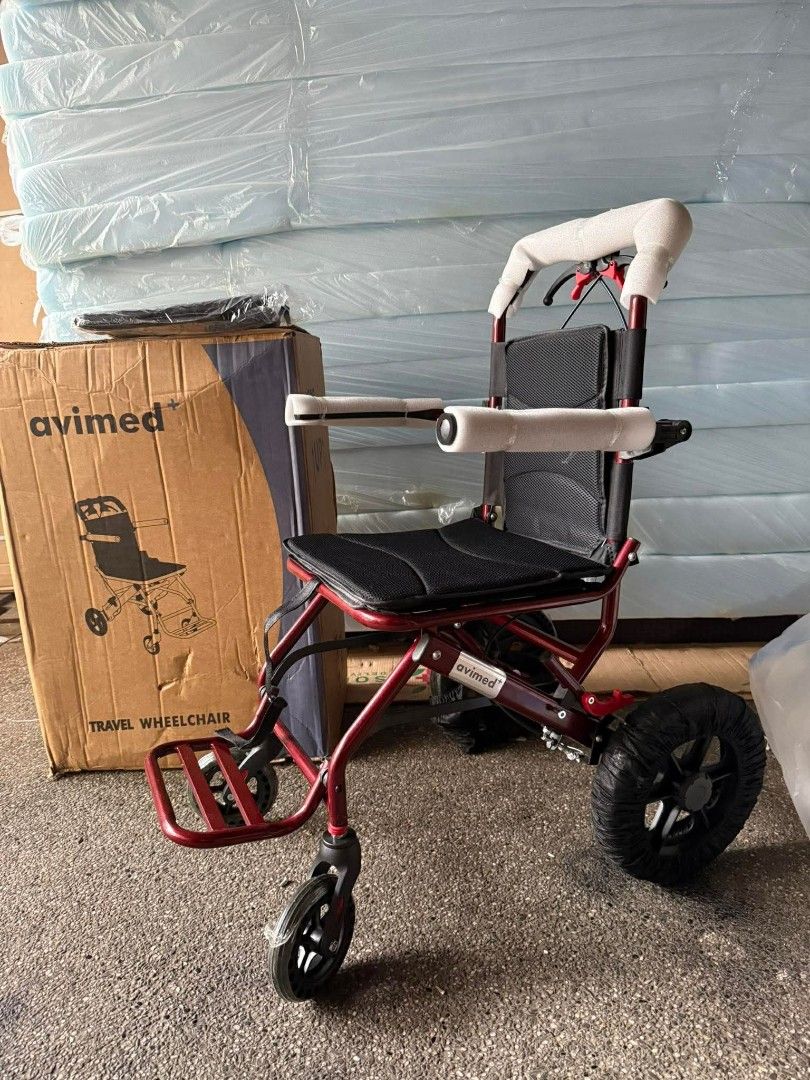 Light weight Travel Wheelchair (Category: Wheelchairs) located in Manila. Submitted by brightflower_273879 (Listing ID 1436528563, Image 1). Description: - Avimed travel wheelchair - Red frame - Black seat and backrest - Includes footrests and armrests - Foldable design for easy transport - Comes with original box.