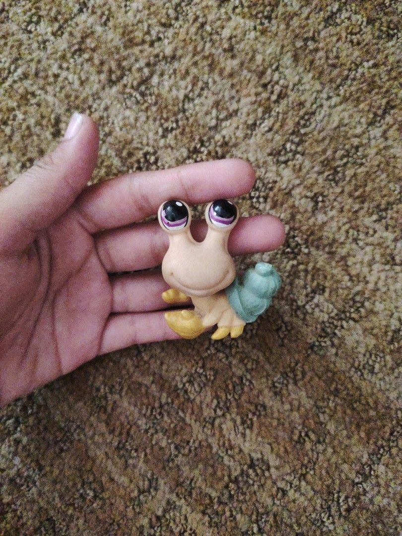 Littlest Pet Shop Hermit Crab Figure (Category: Designer & Blind Box Toys) located in Subic. Submitted by booley (Listing ID 1436474803, Image 1). Description: - Littlest Pet Shop hermit crab figure - Light tan body - Large black eyes - Light green shell .