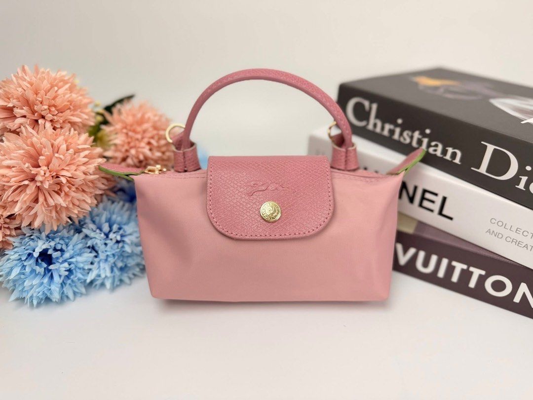 Longchamp Le Pliage Mini (Category: Luxury Bags & Wallets) located in Jaen. Submitted by hallofluxee (Listing ID 1436600490, Image 1). Description: Authentic Longchamp Le Pliage handbag in pink. Features top handle, detachable shoulder strap, and gold-toned hardware. Compact size, perfect for daily use. Made of nylon and leather..