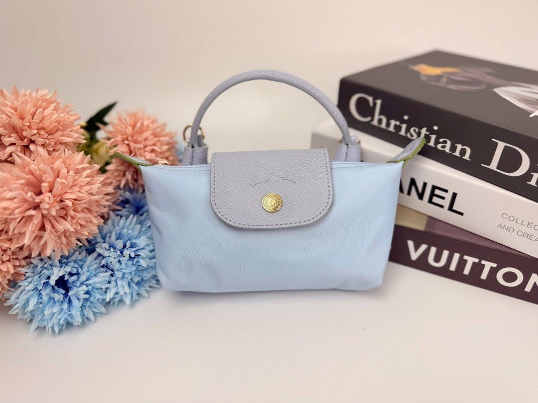 Longchamp Le Pliage Mini (Category: Luxury Bags & Wallets) located in Jaen. Submitted by hallofluxee (Listing ID 1436601056, Image 1). Description: Authentic Longchamp Le Pliage Cuir crossbody bag in light blue. Features a flap closure with gold-tone hardware. Perfect for everyday use..