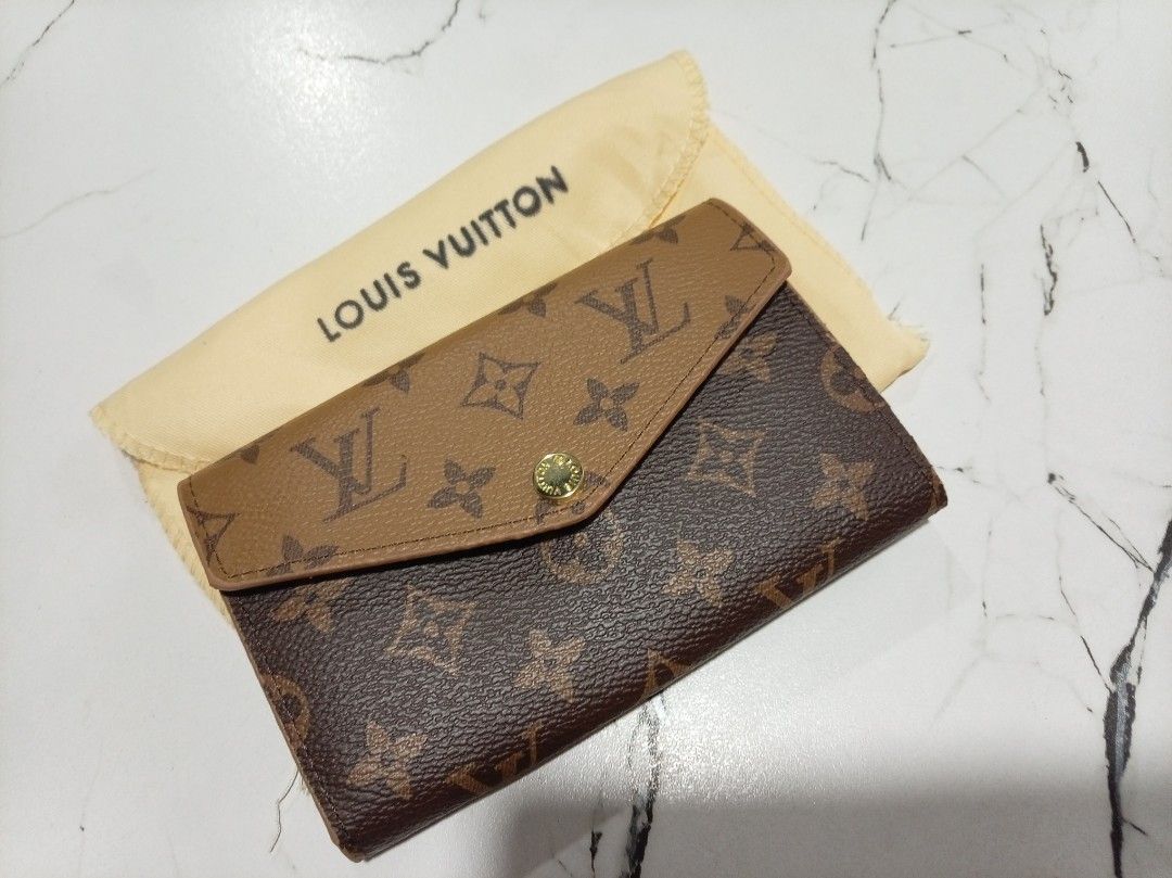 Louis Vuitton Monogram Wallet (Category: Luxury Bags & Wallets) located in Cavite. Submitted by cheleshops (Listing ID 1436377815, Image 2). Description: For Sale!!! LV Monogram Long Wallet/Dual Color Negotiable Slightly Used Japan Source With Dustbag Coded - Authentic Louis Vuitton wallet - Features the classic monogram pattern - Flap closure with button - Includes original Louis Vuitton dust bag.