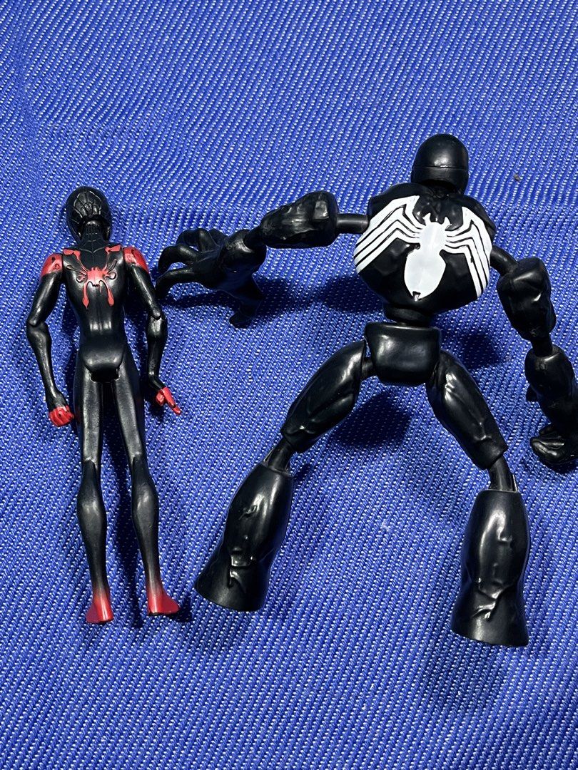 Marvel Spider-Man Miles Morales and Venom Figures (Category: Figurines & Statues) located in Cabanatuan. Submitted by isaiahave (Listing ID 1436471538, Image 2). Description: - Marvel action figures for sale! - Includes Miles Morales and Venom figures. - Miles Morales: Black and red suit. - Venom: Features white spider symbol on chest and back. - Both figures are in a standing pose. - Made of plastic..