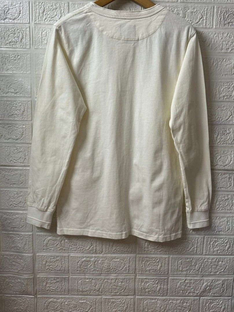 Men's Henley Long Sleeve Shirt (Category: Tshirts & Polo Shirts ) located in General Santos City (Dadiangas). Submitted by markinho_ideas (Listing ID 1436504707, Image 3). Description: - Cream-colored long sleeve Henley shirt - Features a three-button placket - Ribbed cuffs - Crew neck - Relaxed fit - Made of soft, comfortable material - Perfect for casual wear.