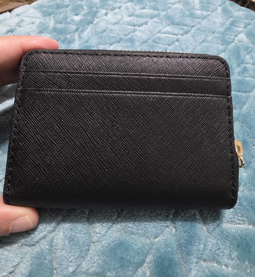 Michael Kors Jet Set Travel Zip Card Case (Category: Luxury Bags & Wallets) located in Mandaluyong City. Submitted by mlstuff28 (Listing ID 1436470525, Image 3). Description: - Brand new Michael Kors Jet Set Travel card case. - Color: Black - Material: Leather - Features: - Multiple card slots - Zippered compartment - Gold-tone zipper and logo - Condition: New with tags.