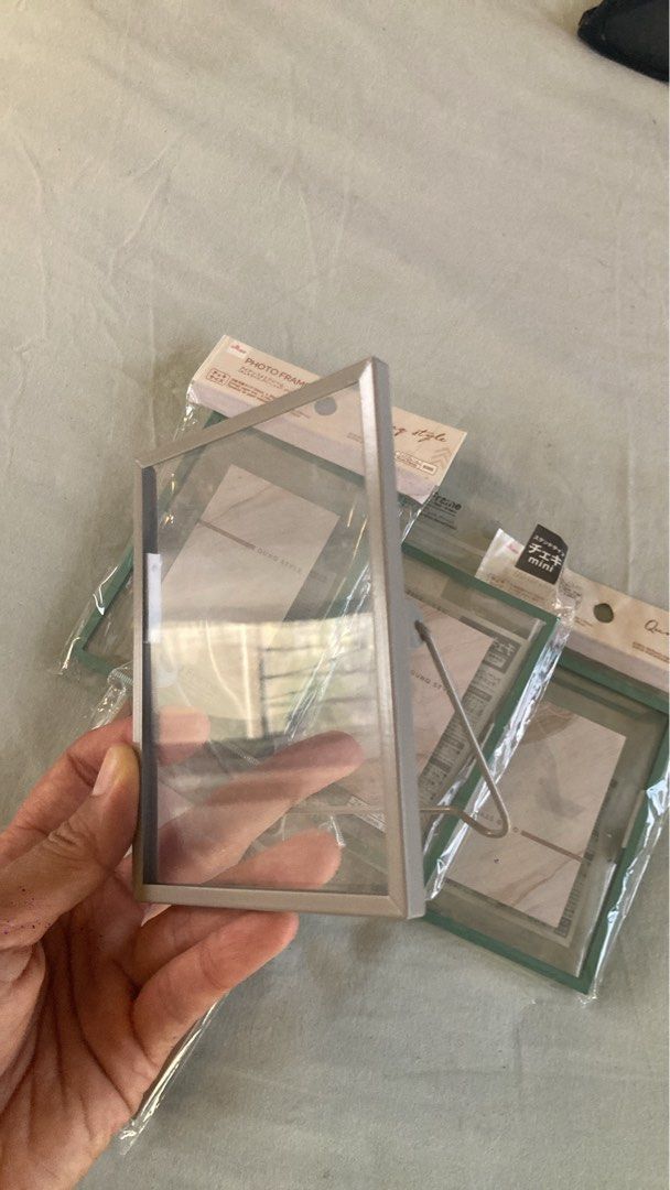 Mini Photo Frames (Category: Frames & Pictures) located in Makati City. Submitted by jessicainstyle (Listing ID 1436532927, Image 2). Description: - Brand new, still in original packaging - 54mm x 86 mm / 2.12 in x 3.38 in - Set of mini photo glass frames : 3x turquoise; 1x old pink; 1x grey - Clear front and back - Colored border - Includes a stand - Perfect for small photos or artwork .