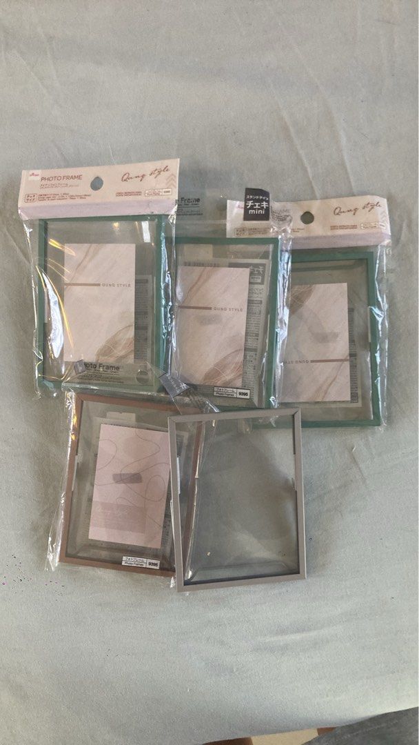 Mini Photo Frames (Category: Frames & Pictures) located in Makati City. Submitted by jessicainstyle (Listing ID 1436532927, Image 1). Description: - Brand new, still in original packaging - 54mm x 86 mm / 2.12 in x 3.38 in - Set of mini photo glass frames : 3x turquoise; 1x old pink; 1x grey - Clear front and back - Colored border - Includes a stand - Perfect for small photos or artwork .